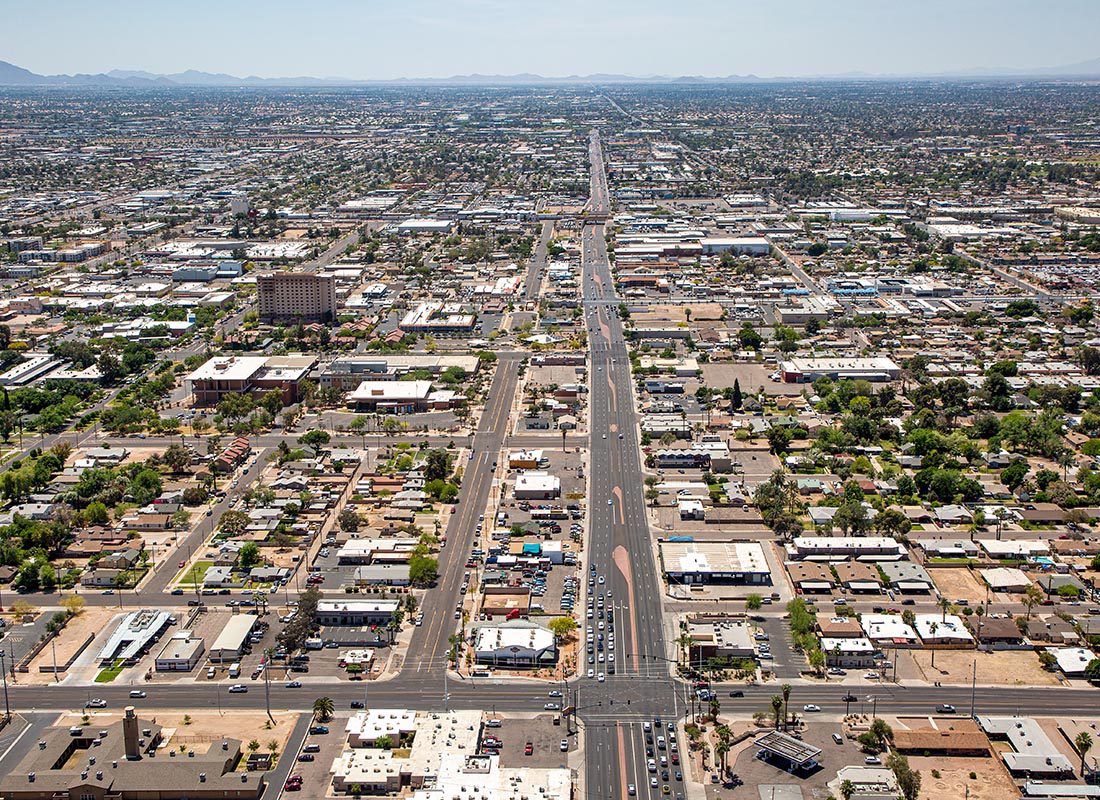 Mesa, AZ - Aerial View of Mesa, AZ With Mountain Ranges in the Distance on a Sunny Day